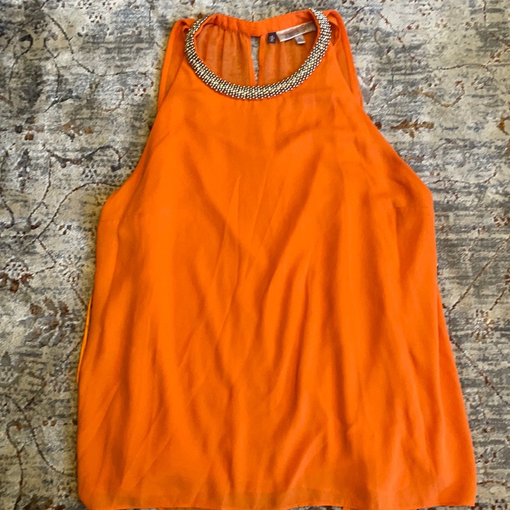 Nice orange top by Jennifer Lopez